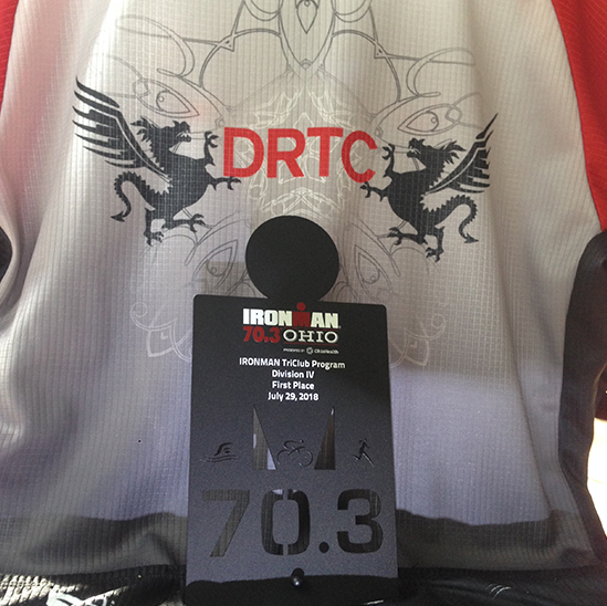 Back of Mark's DRTC jersey with his IronMan Ohio 70.3 first place plate